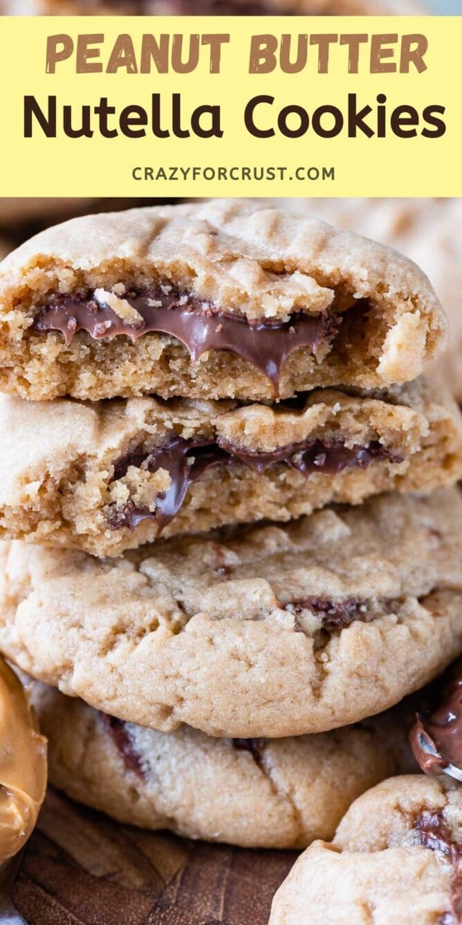 stack of peanut butter cookies with cut in half cookies on top stack with Nutella inside