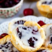 cherry pie danish with drizzle on a stack of bites