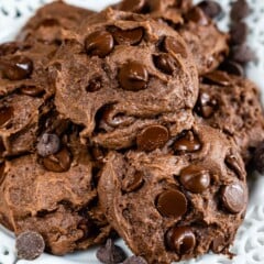 Stack of chocolate cake mix cookies on a white plate