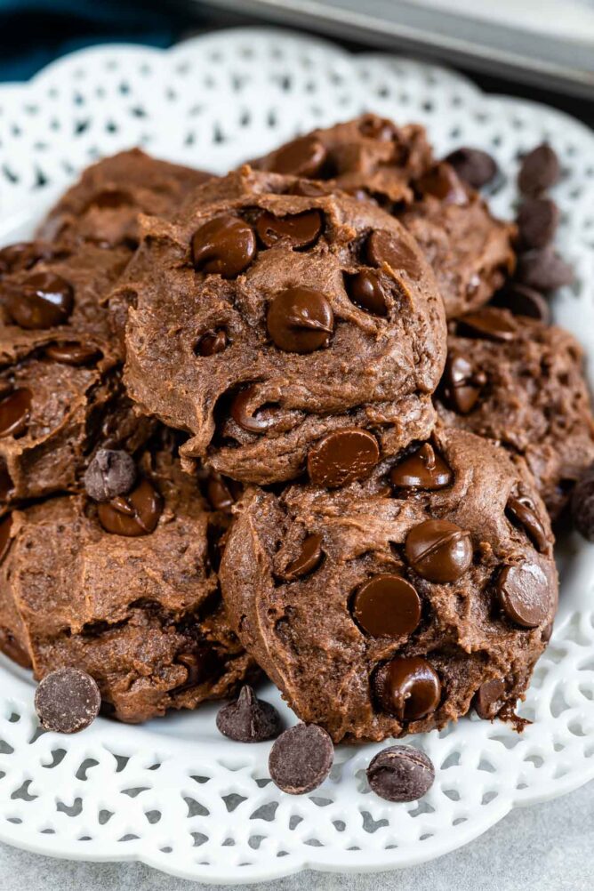 Stack of chocolate cake mix cookies on a white plate