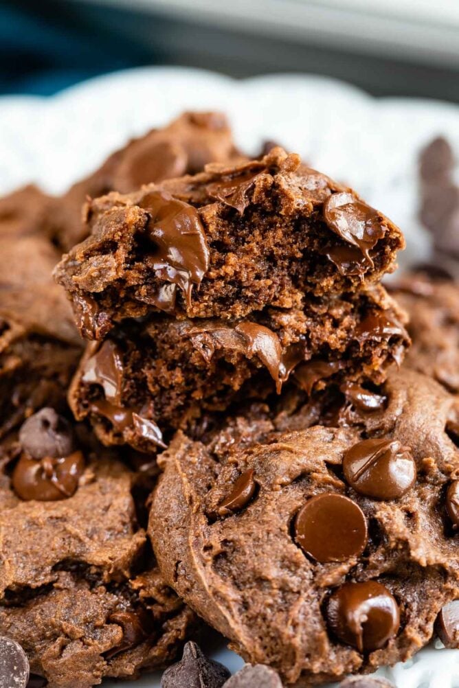 Chocolate cake mix cookies with one split in half to show inside of cookie