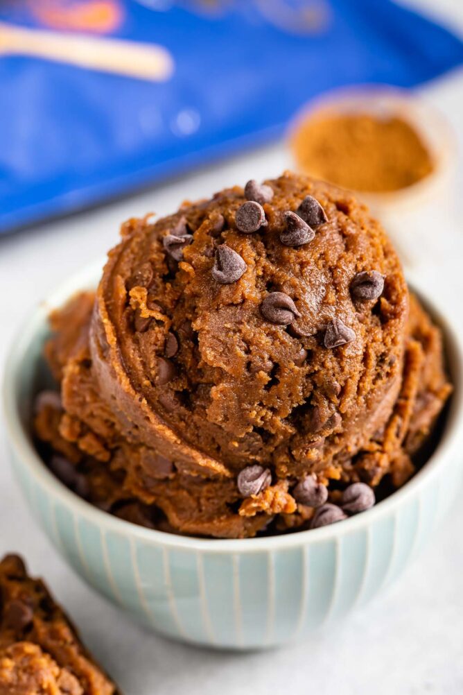 Bowl full of double chocolate chip edible cookie dough with chocolate chips on top