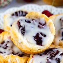 cherry pie danish with drizzle on a stack of bites