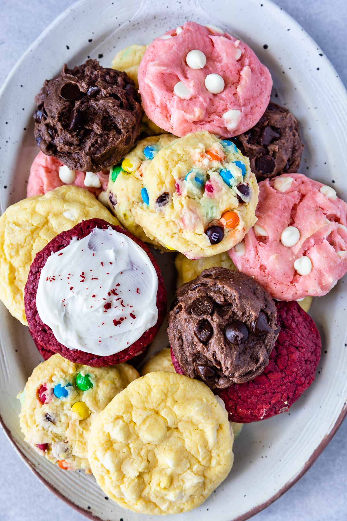 Overhead shot of a bunch of different cake mix cookies on a serving plate