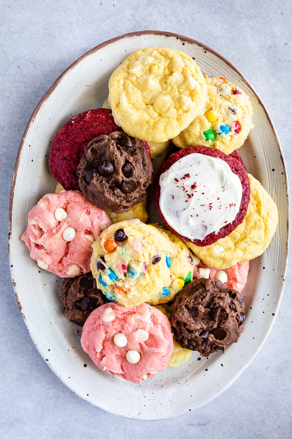 Overhead shot of a bunch of different cake mix cookies on a serving plate