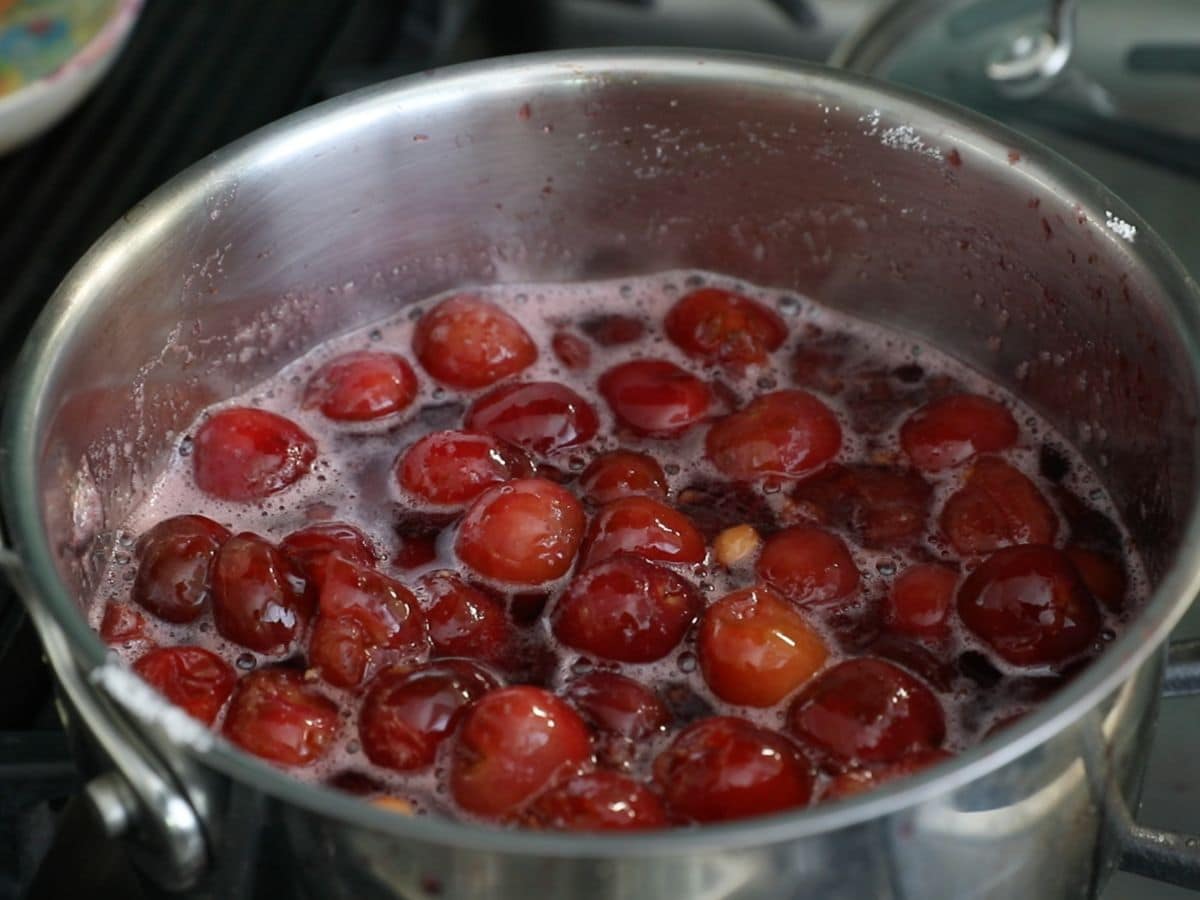 boiling cherries in saucepan.