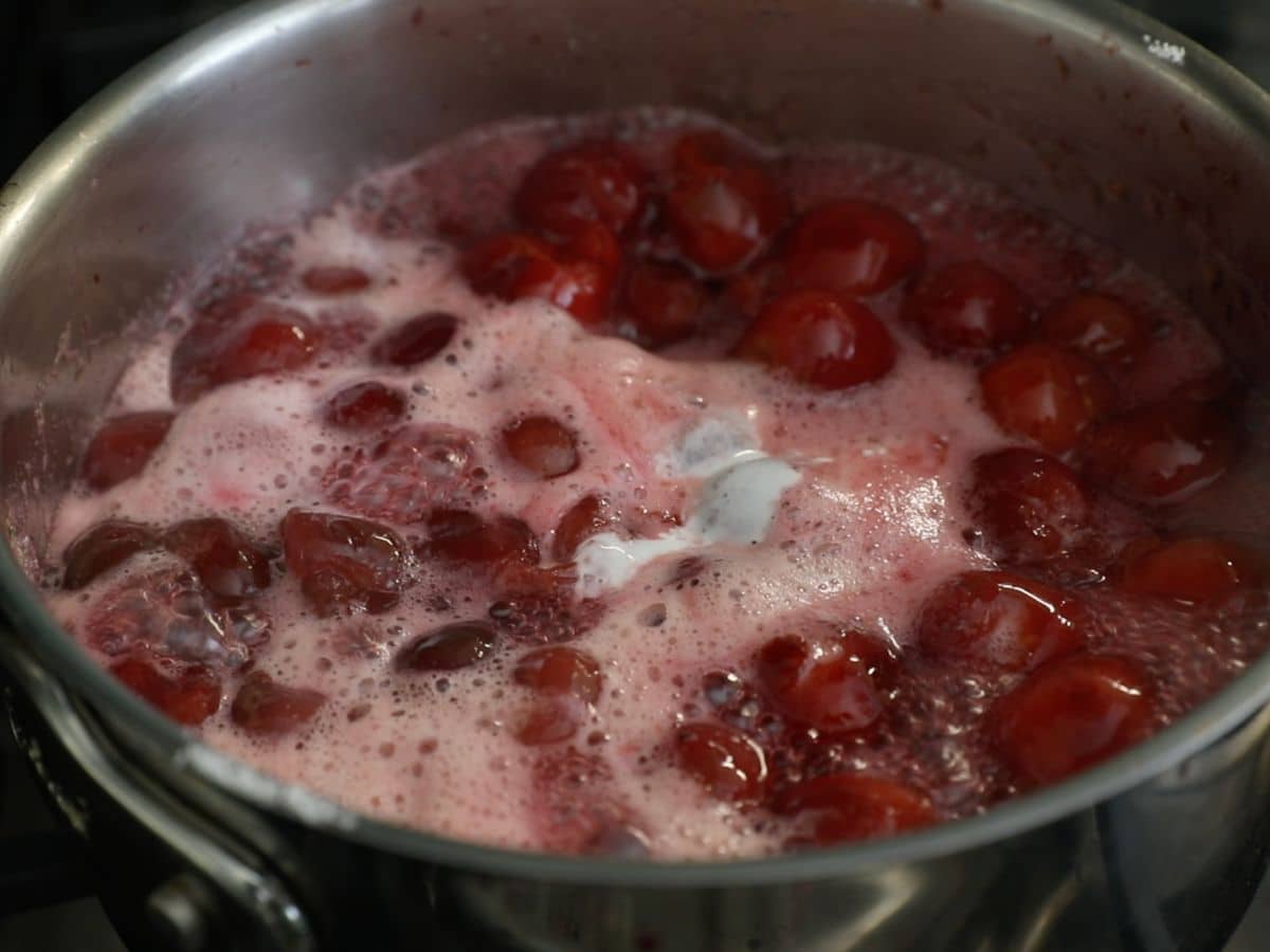 cherries in saucepan with slurry.