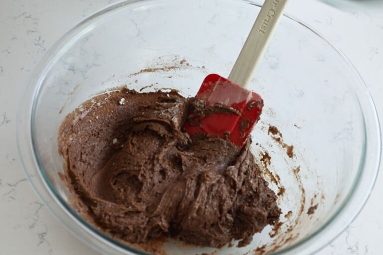 cookie batter in large bowl with spatula.