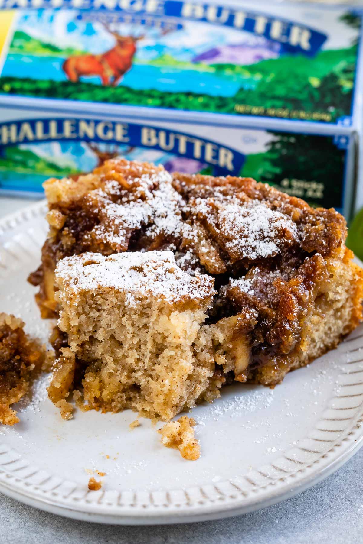 Apple Coffee Cake slice with bite missing on white plate