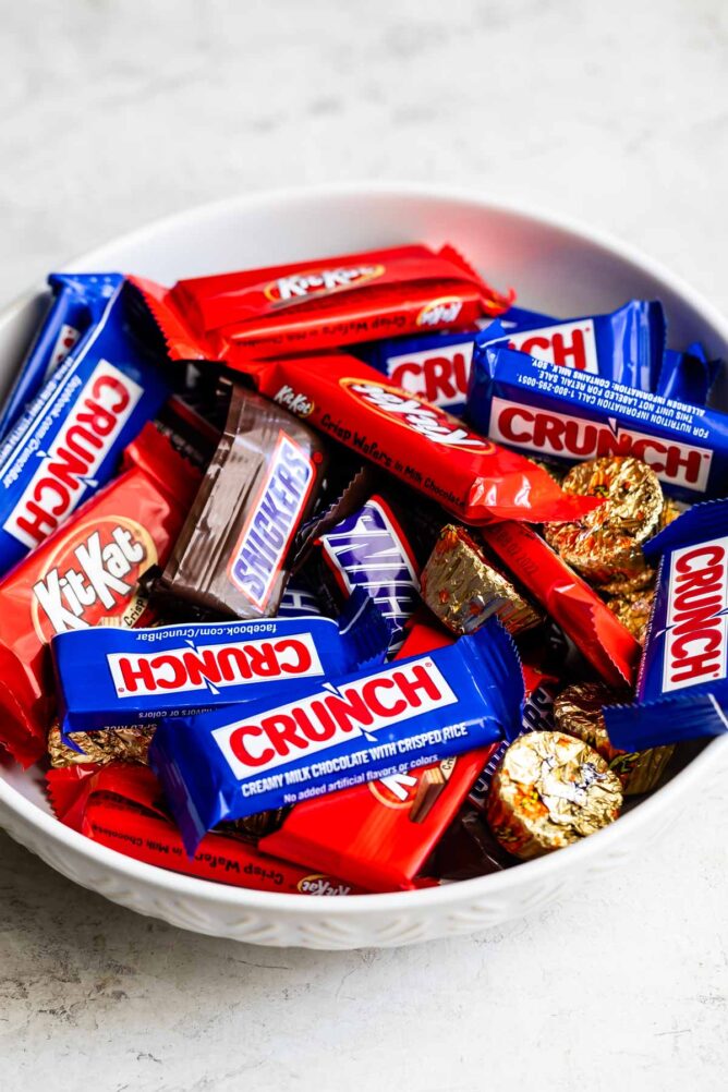 Bowl of mini chocolate candies in their wrappers