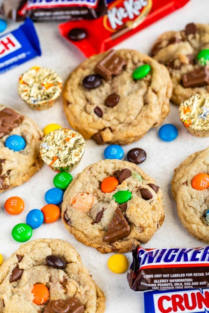 Candy bar cookies with pieces of chocolate candies all around