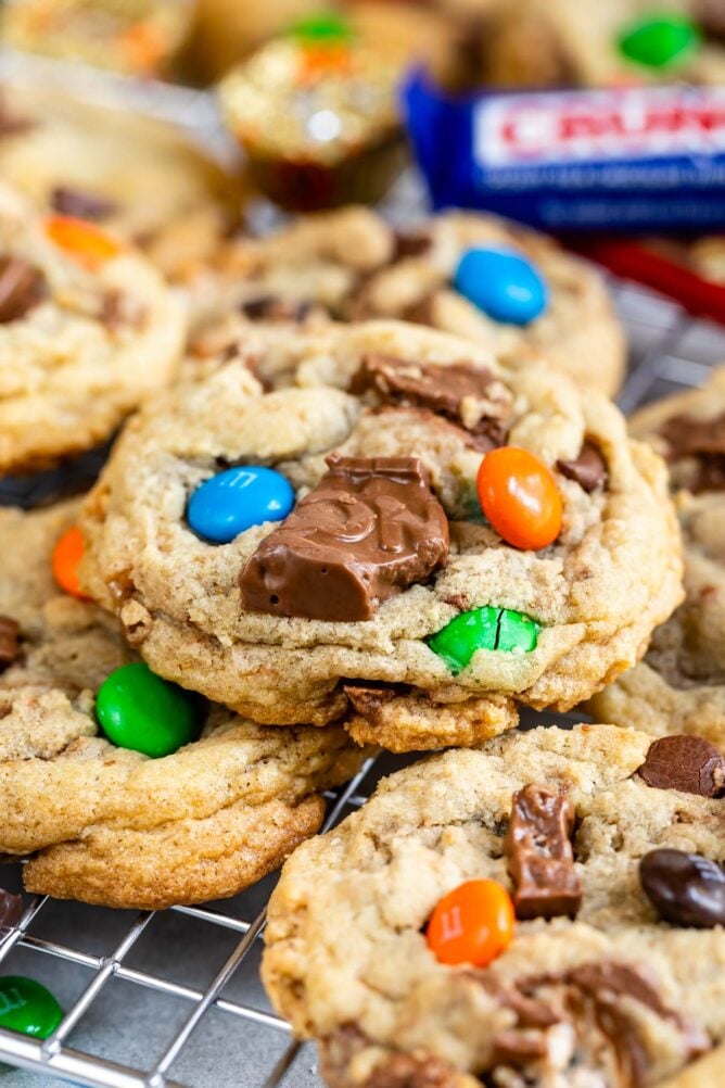 Close up shot of candy bar cookies on a metal cooling rack