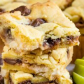 Stack of Caramel Apple Gooey Bars with rolo candies around them