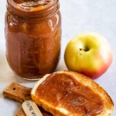 Apple butter in a mason jar and spread on a piece of toast