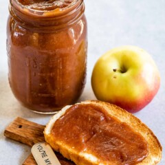 Apple butter in a mason jar and spread on a piece of toast