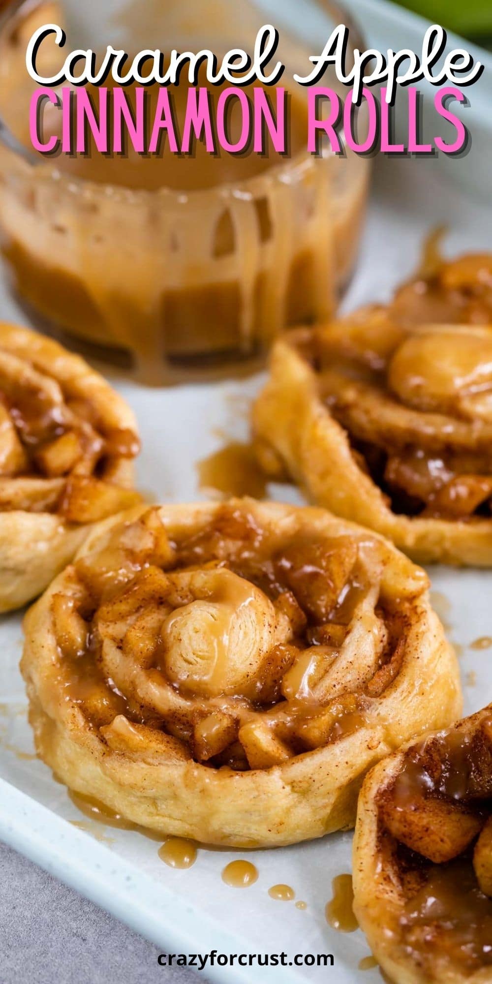 Close up shot of easy caramel apple cinnamon rolls with caramel topping and recipe title on top of image