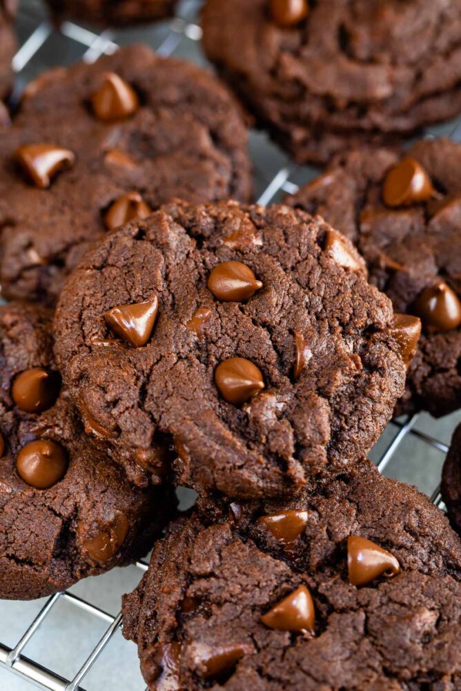 Fudgy Brownie Cookies with chocolate chips on a wire cooling rack