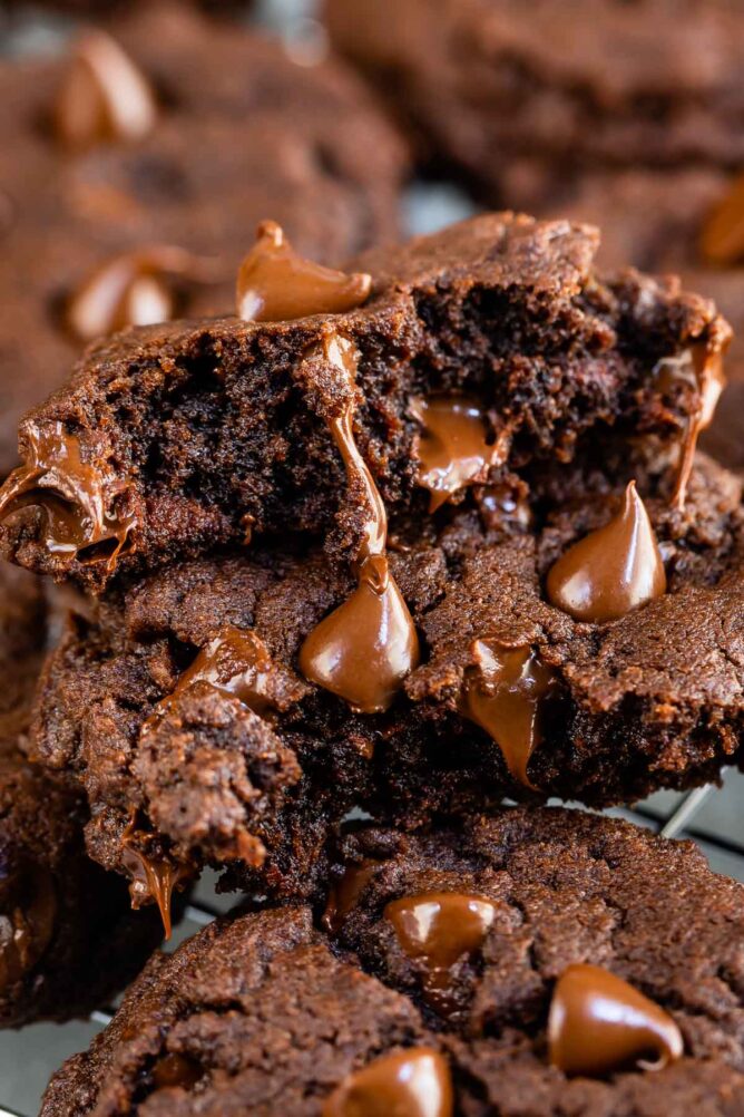 Close up shot of fudgy brownie cookie split in half to show fudgy inside