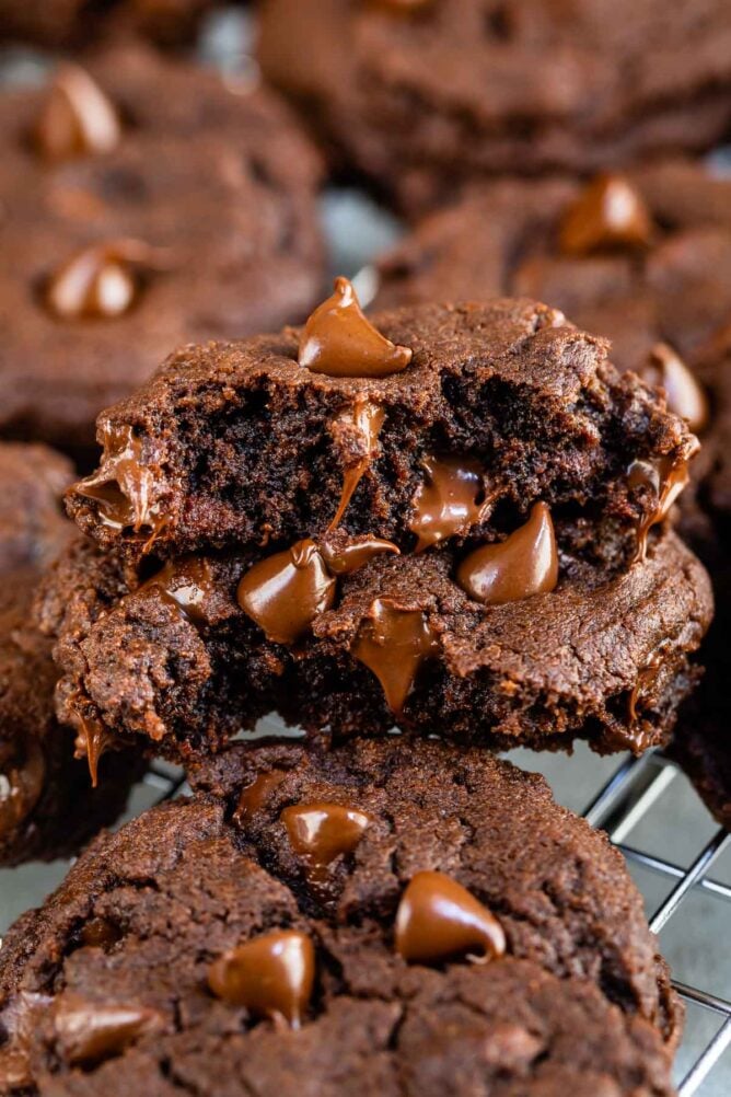 Close up shot of fudgy brownie cookie split in half to show fudgy inside