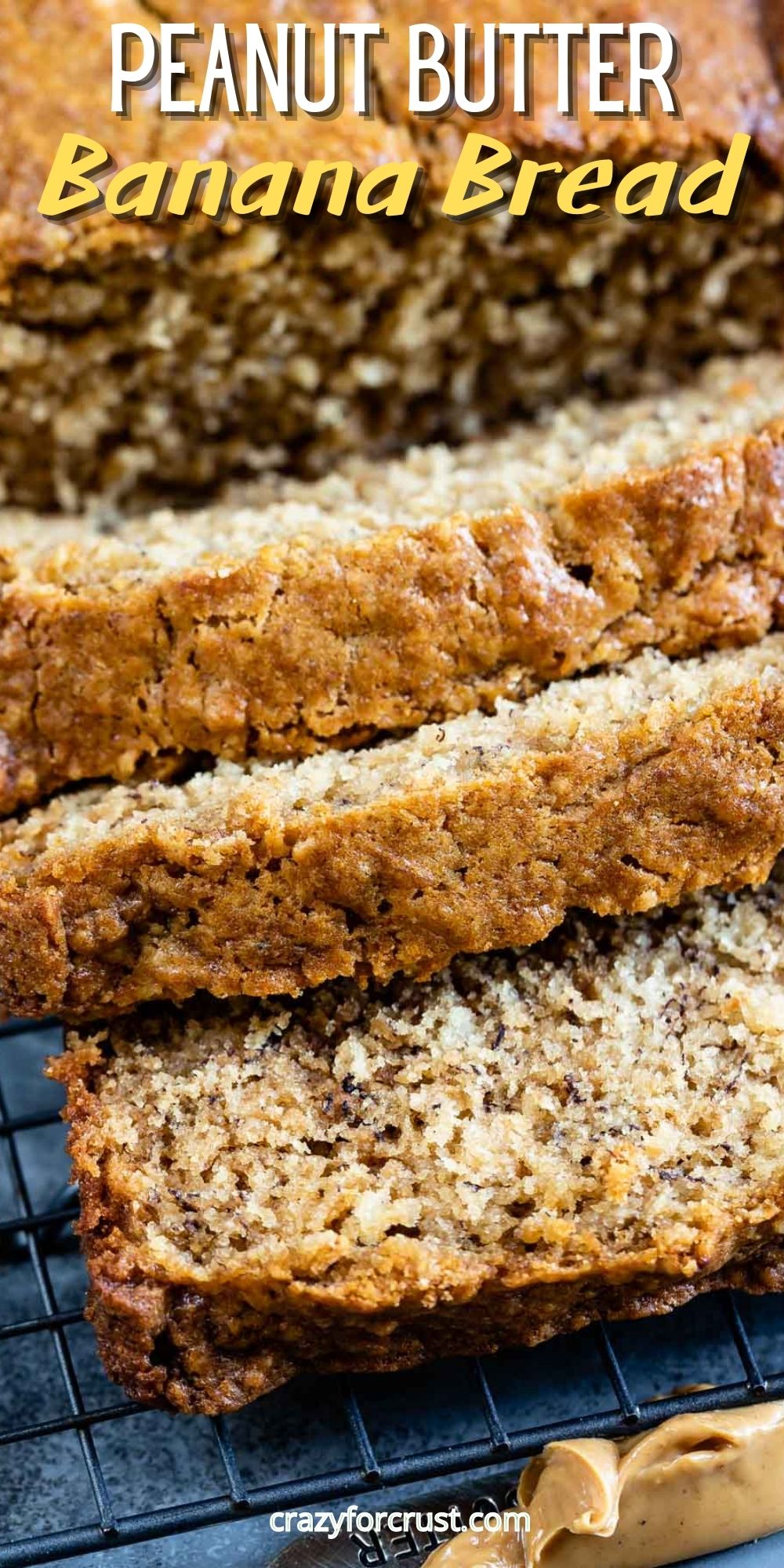 Loaf of peanut butter banana bread with three slices falling off the loaf with recipe title on the top of image