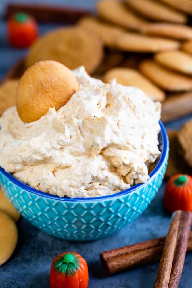 pumpkin fluff in blue bowl with vanilla wafer