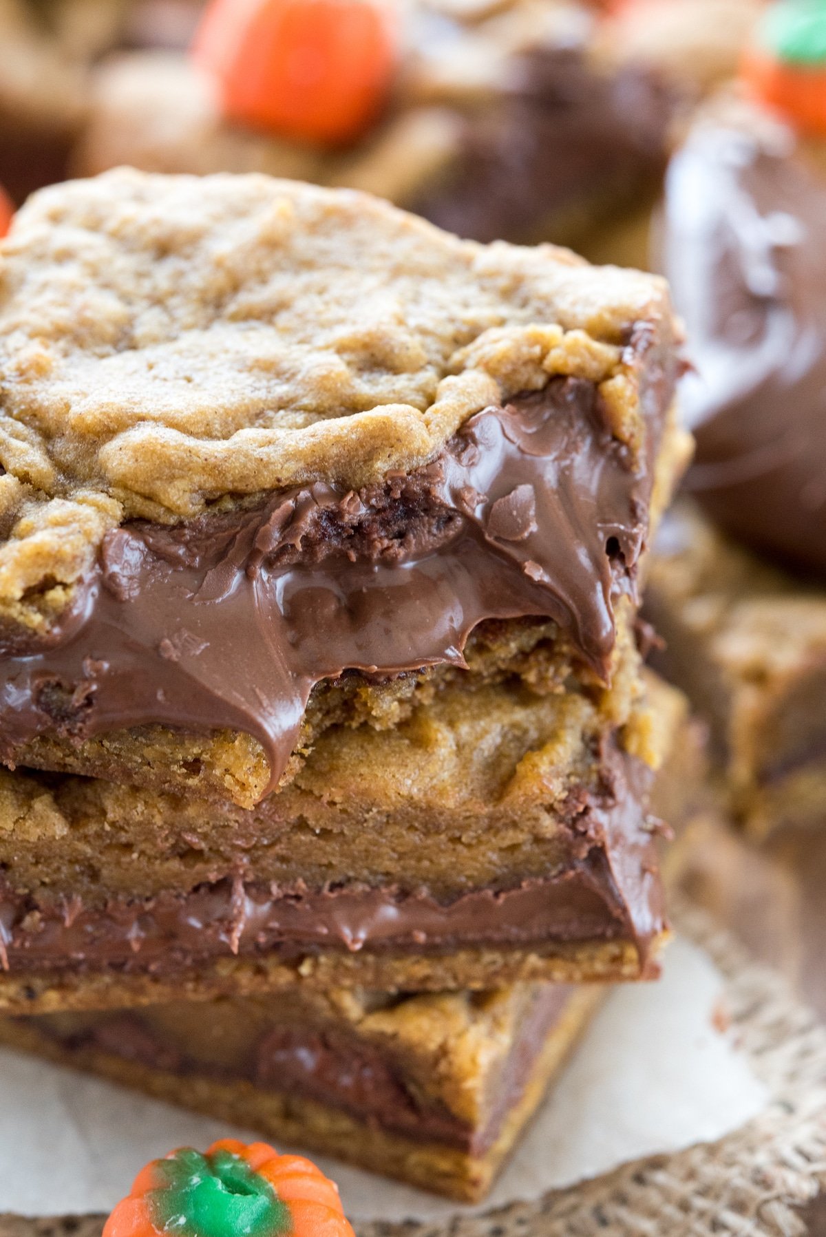 Close up shot of three pumpkin nutella cookie bars