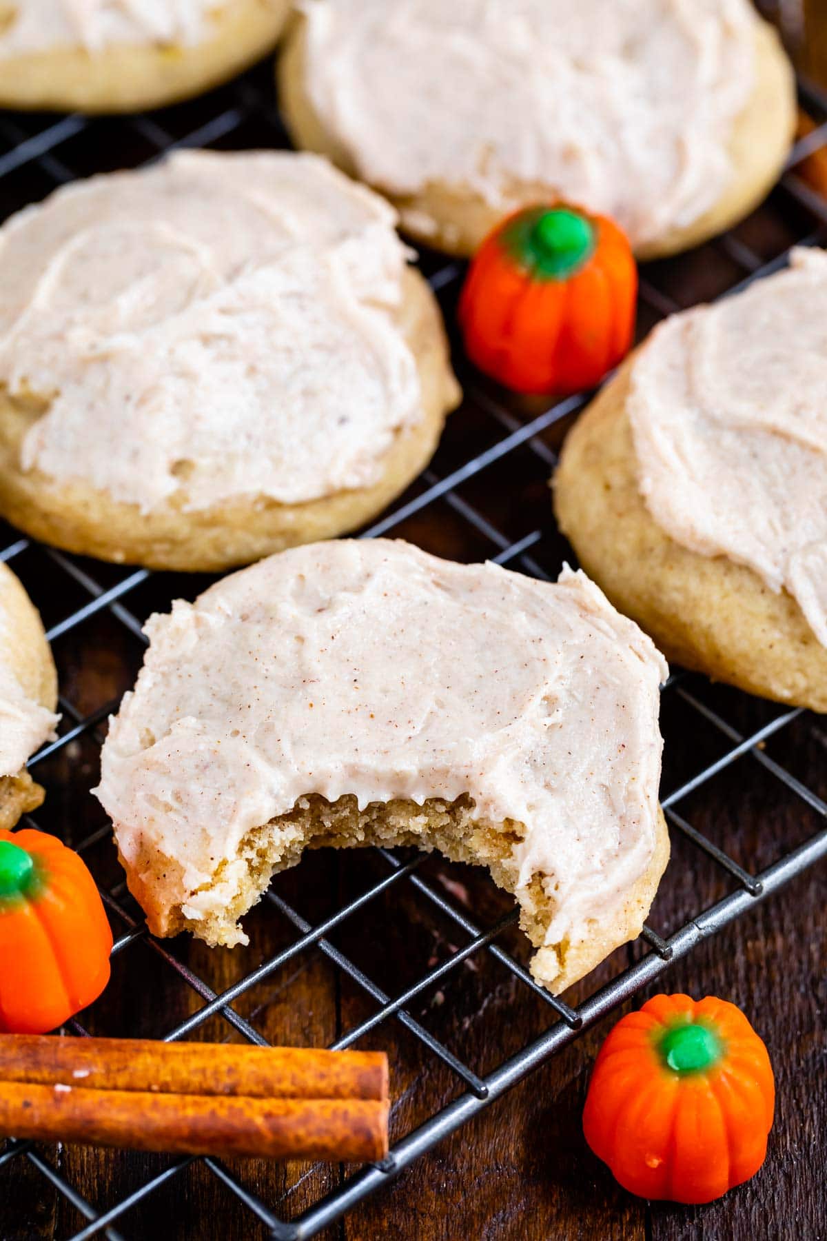 pumpkin spice cookie with frosting on rack