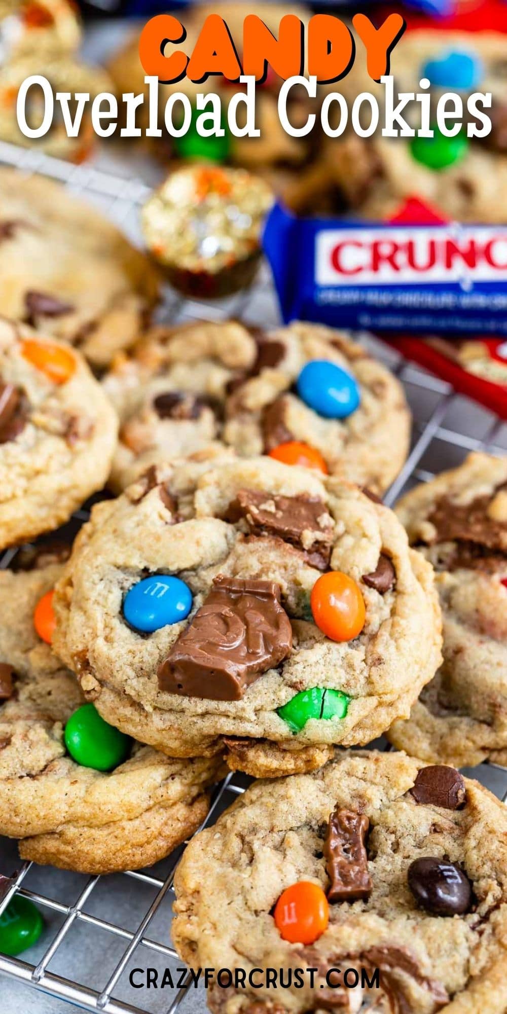 Close up shot of candy bar cookies on a metal cooling rack with recipe title on top of image