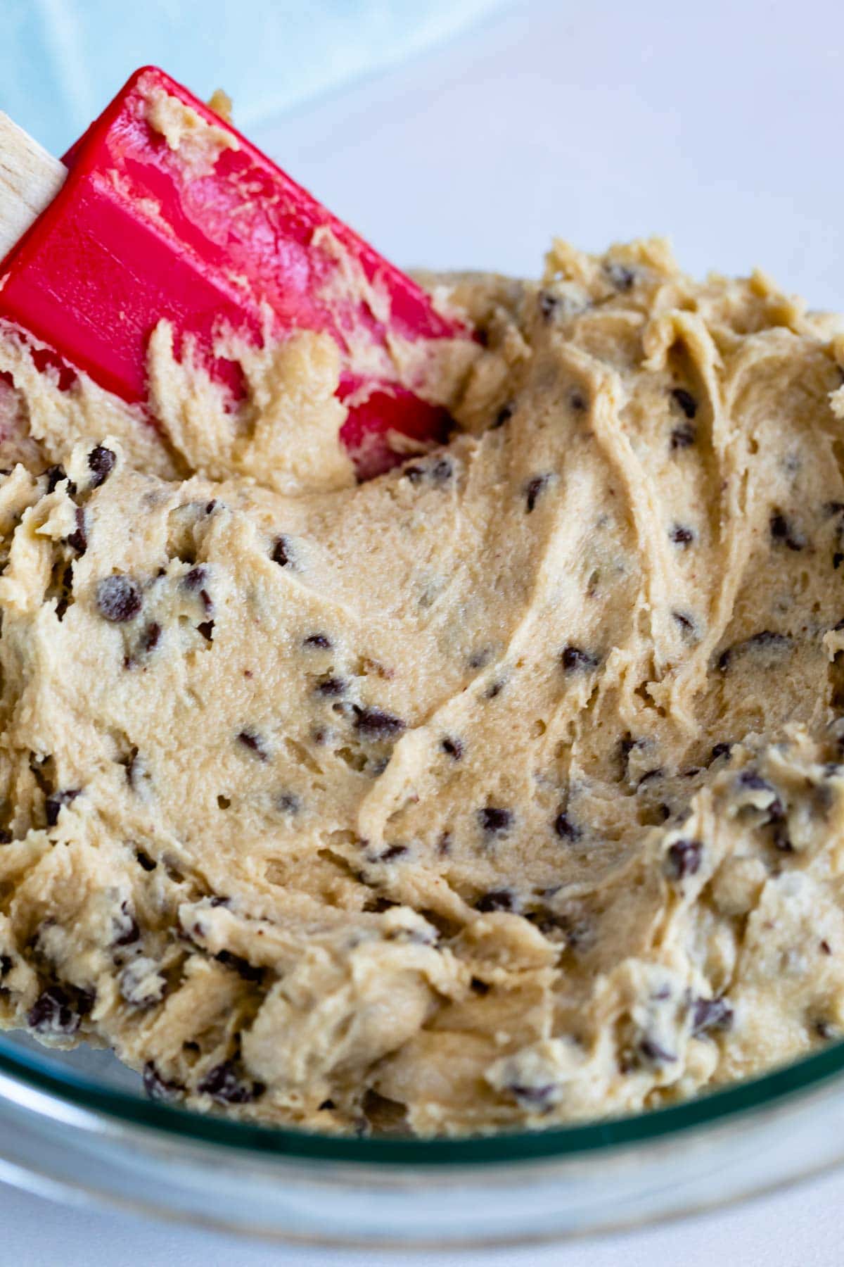 Cookie dough frosting with red spatula