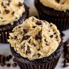 Chocolate cupcakes with cookie dough frosting and mini chocolate chips on top