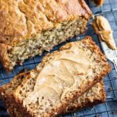 Overhead shot of peanut butter banana loaf and slices topped with a maple glaze