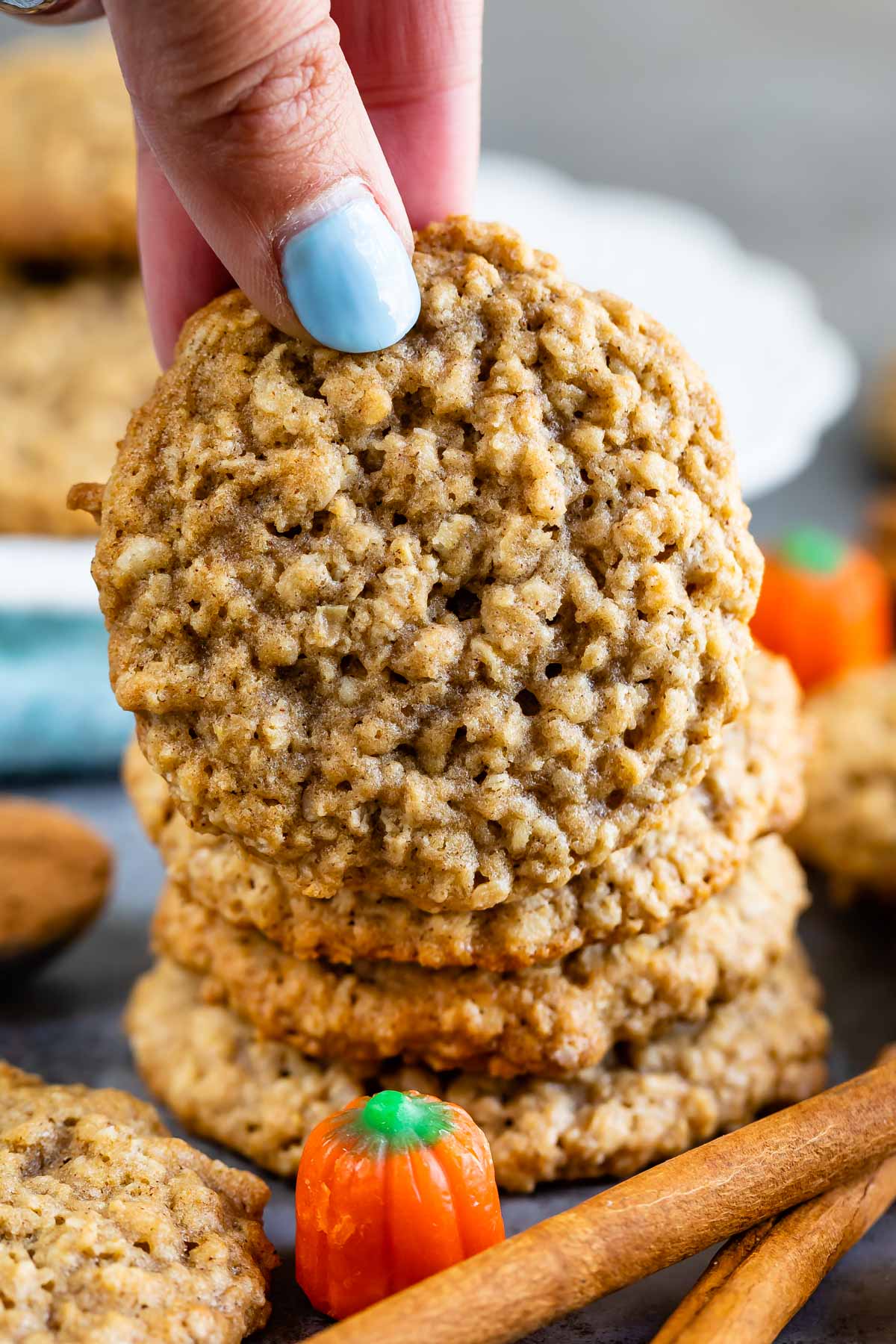 Hand holding pumpkin spice oatmeal cookie