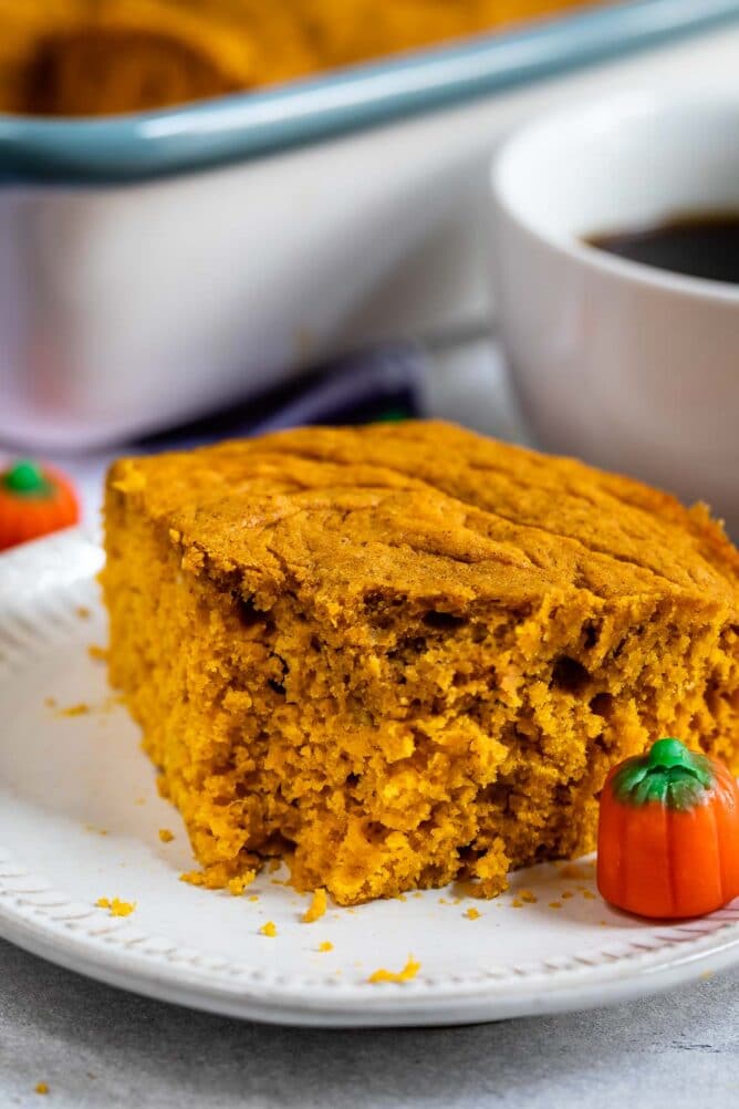 Close up shot of easy pumpkin snack cake with one bite missing