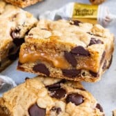 Caramel chocolate chip cookie bars with recipe title on the top of image