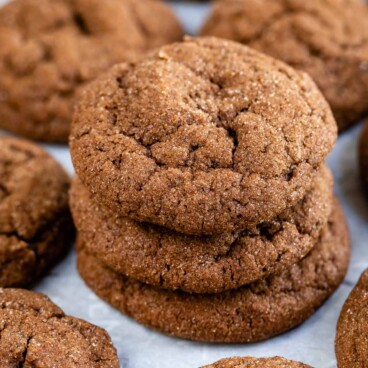 chocolate snickerdoodles stacked on white background