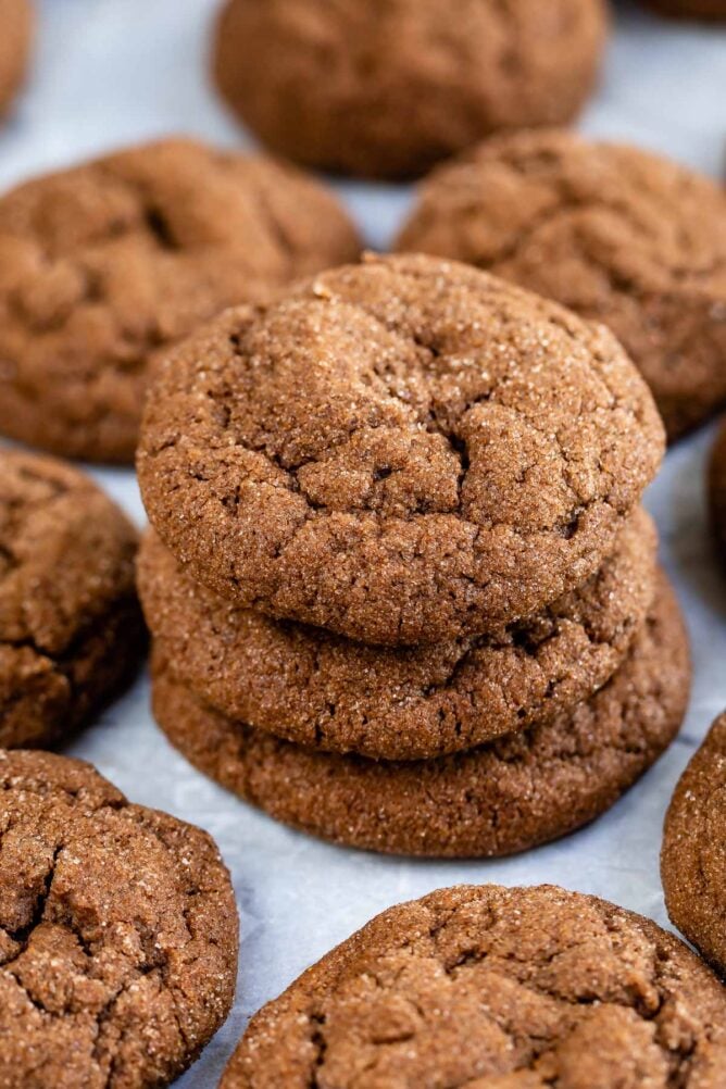 chocolate snickerdoodles stacked on white background