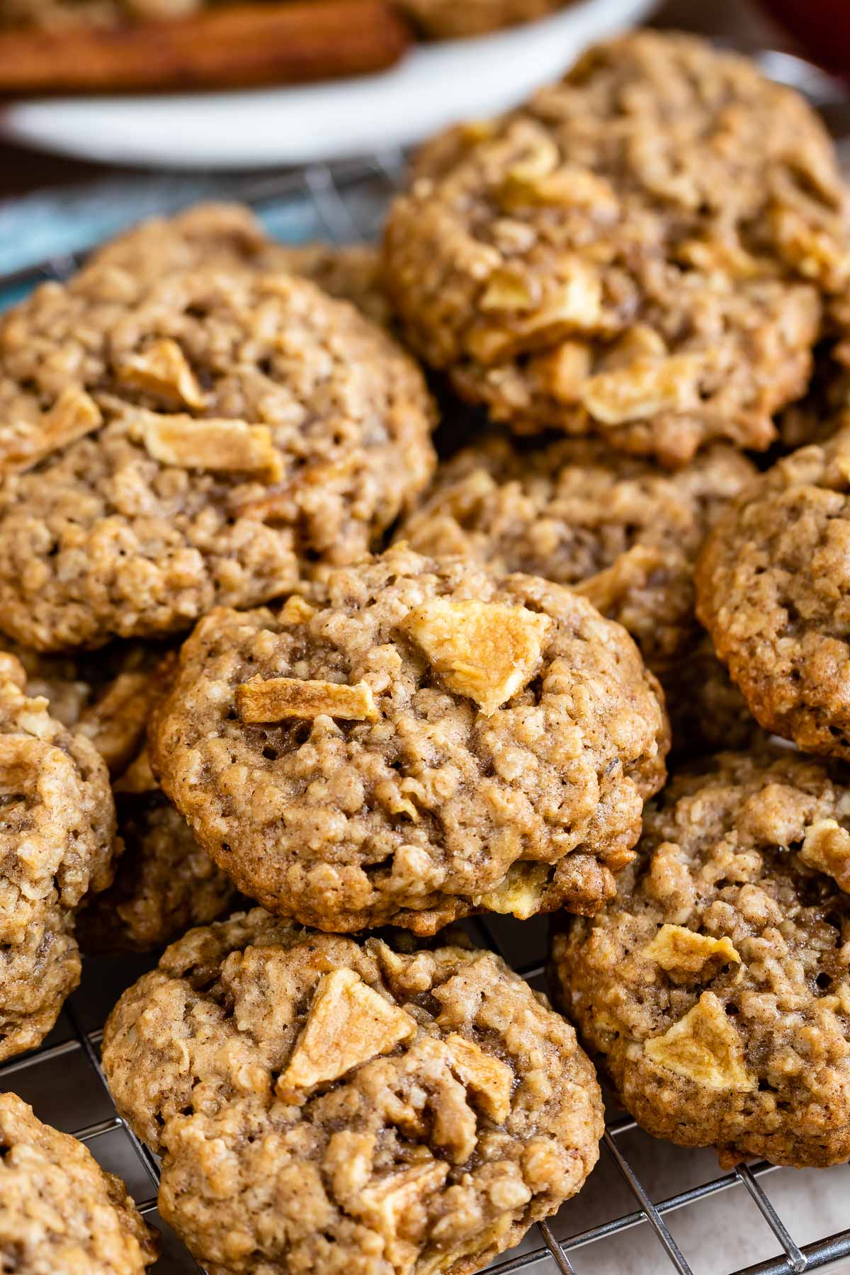 Group of apple oatmeal cookies on a metal cooking rack