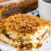 Close up shot of one piece of streusel coffee cake on a white plate