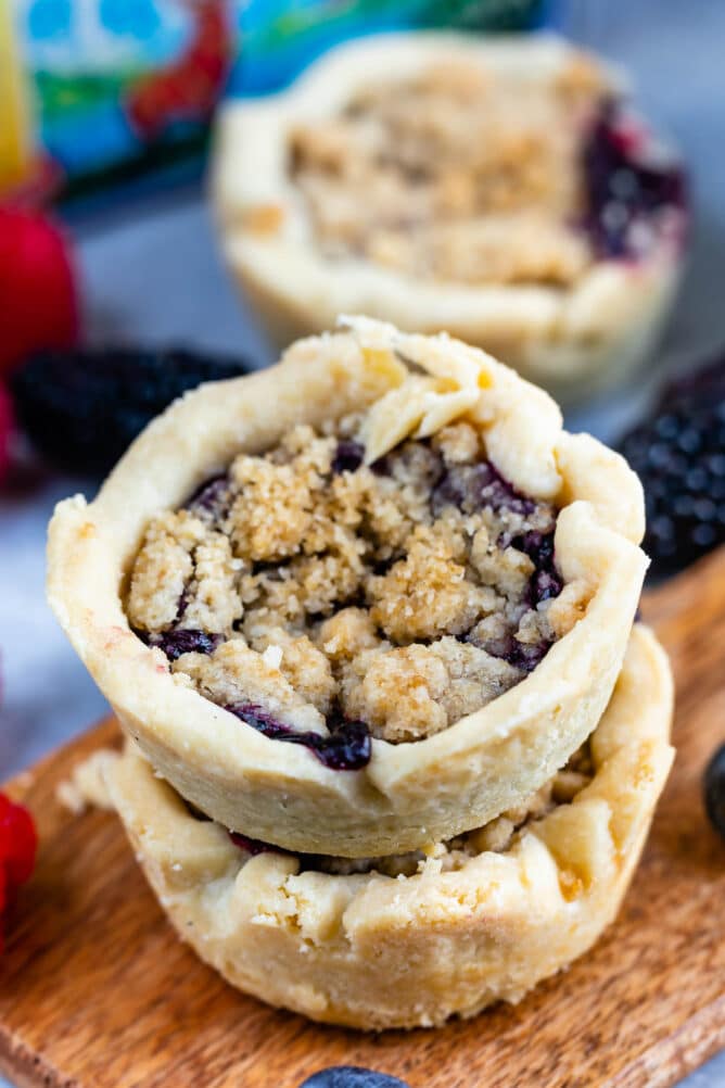Two mini berry pies stacked on top of eachother