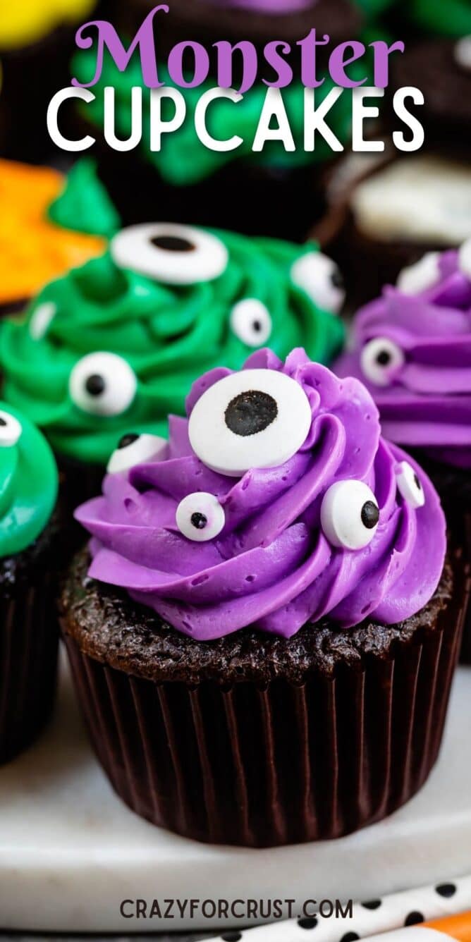 cupcake with purple frosting and candy eyes