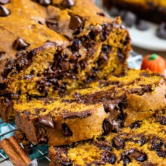 Pumpkin chocolate chip bread loaf with two slices cut off