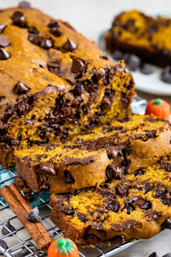 Pumpkin chocolate chip bread loaf with two slices cut off