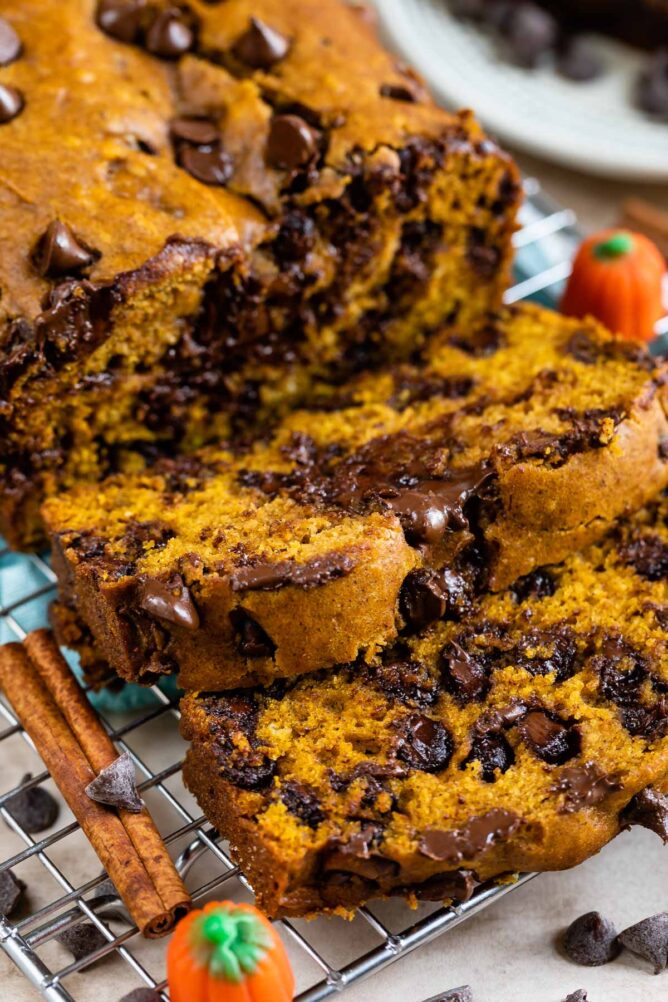 Pumpkin chocolate chip bread loaf with two slices cut off