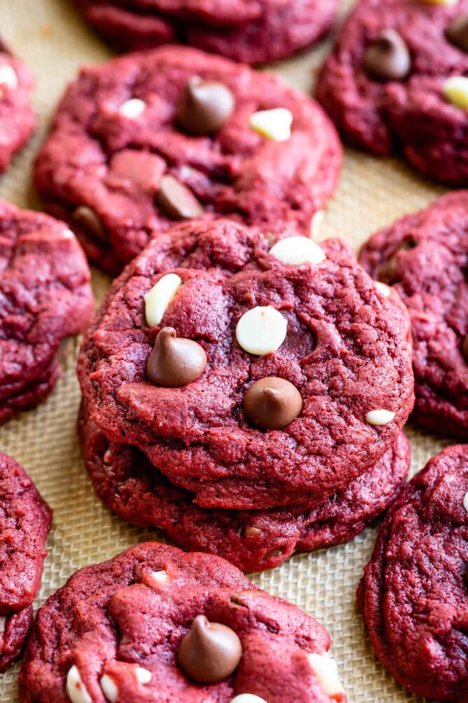 Stack of red velvet cookies with more cookies around it