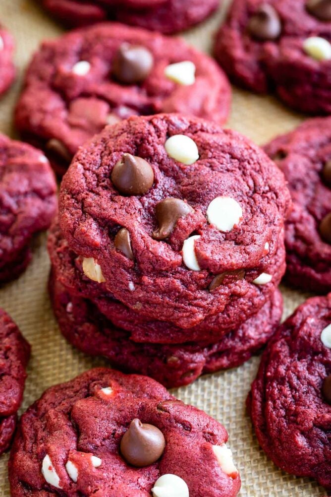 Stack of red velvet cookies with more cookies around it