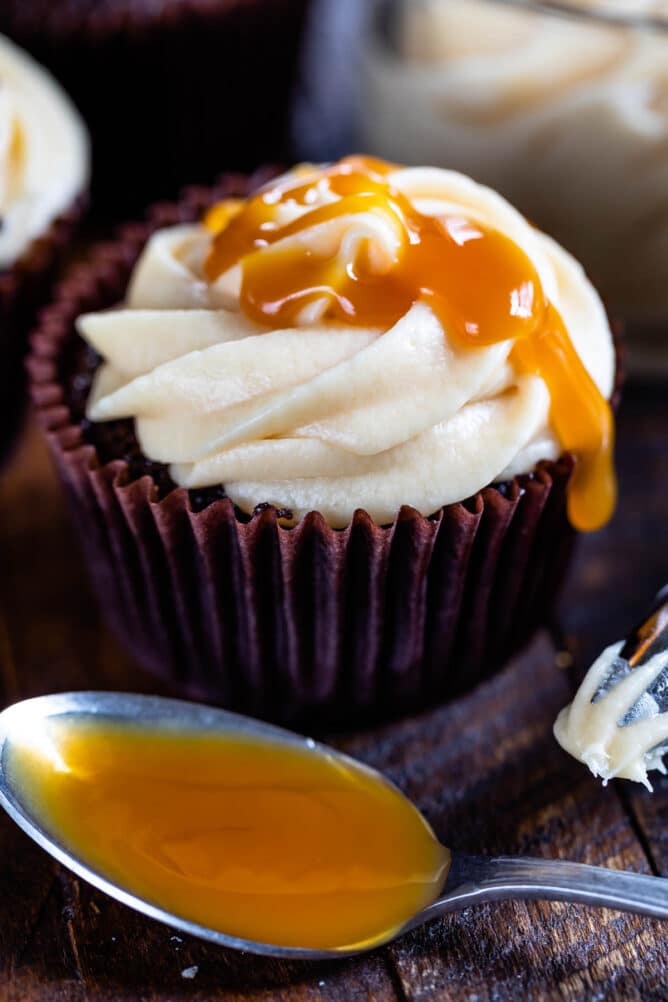 cupcake with frosting drizzled with caramel sauce