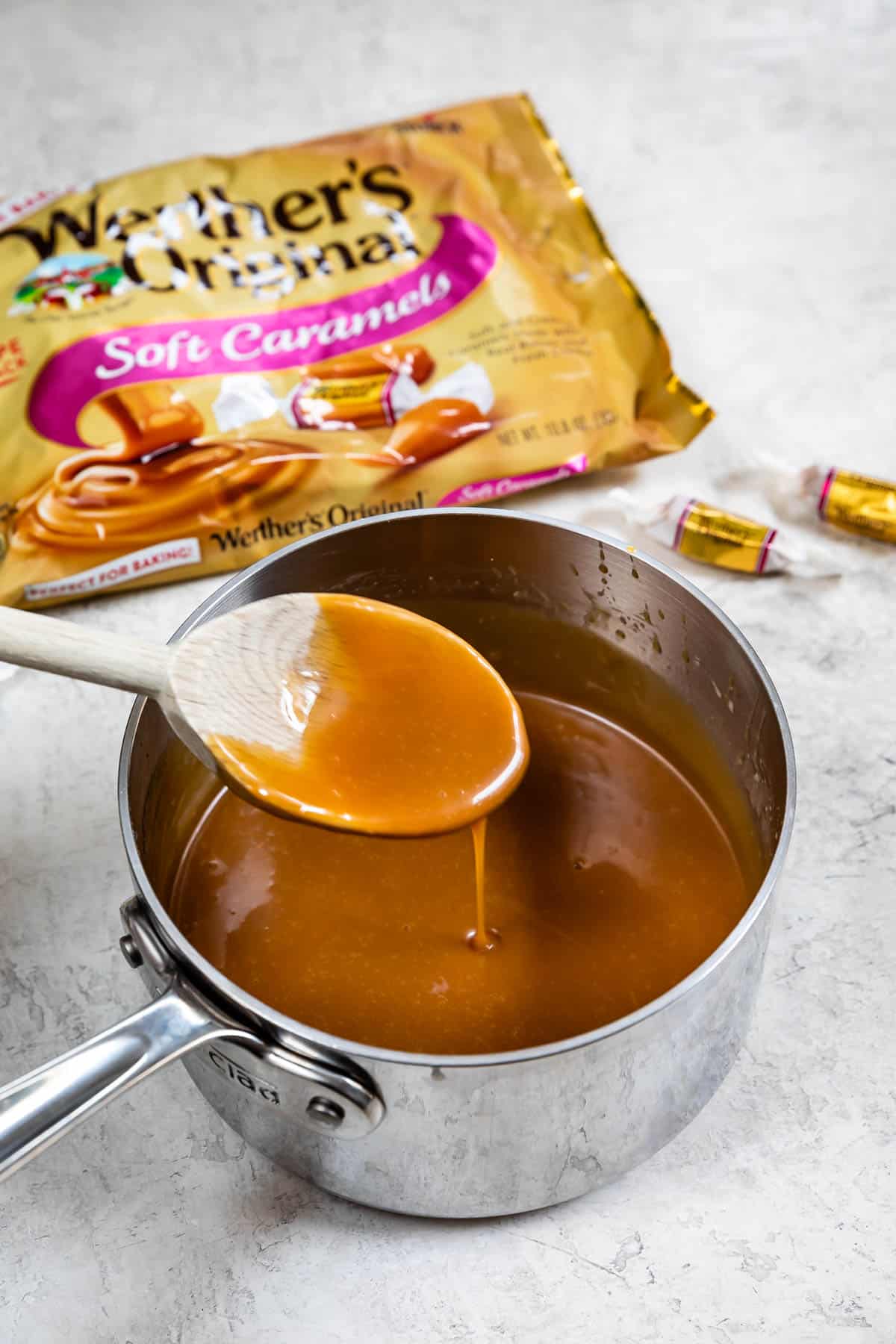 spoon stirring caramel sauce.