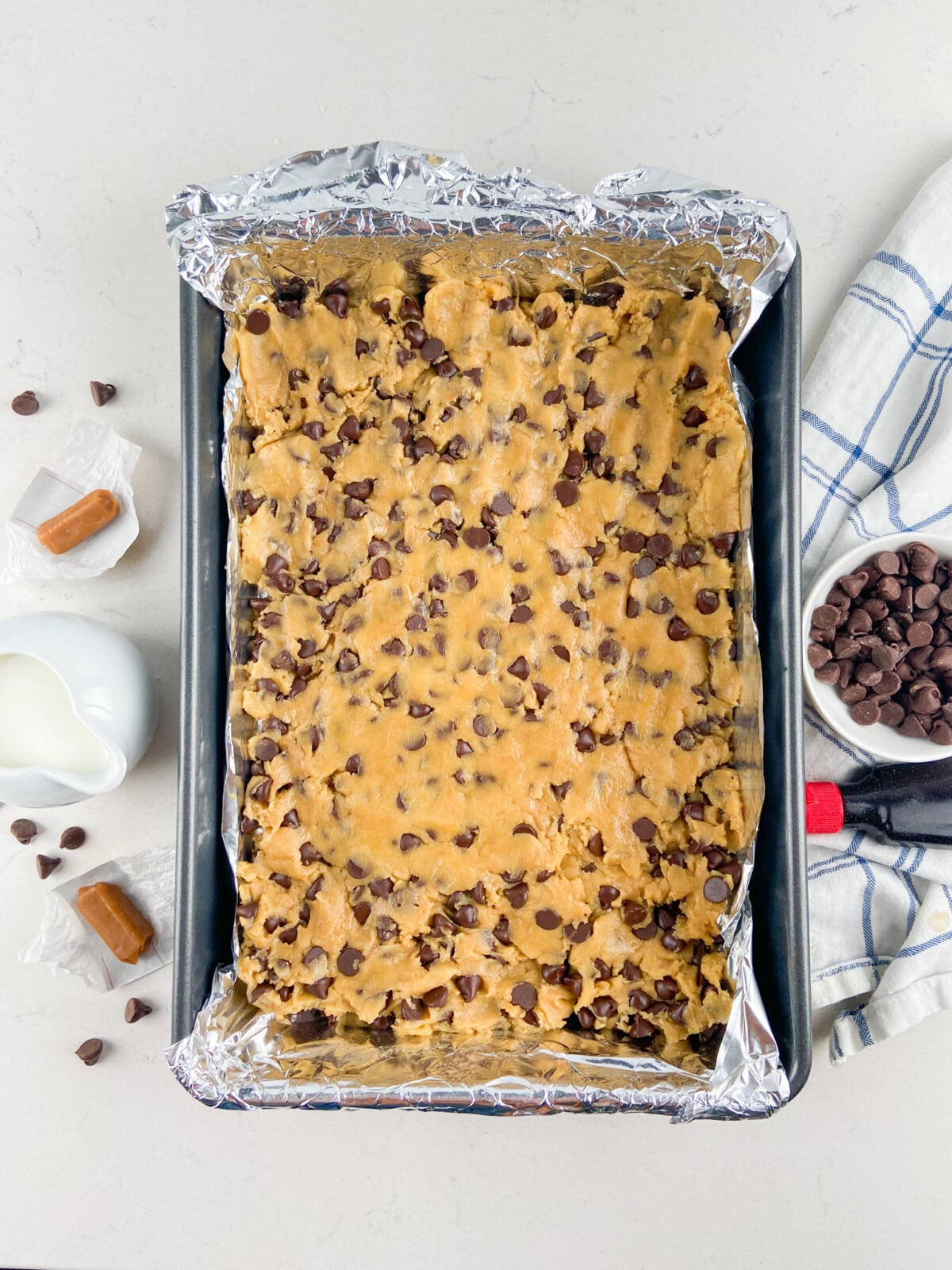cookie dough in foil lined pan.