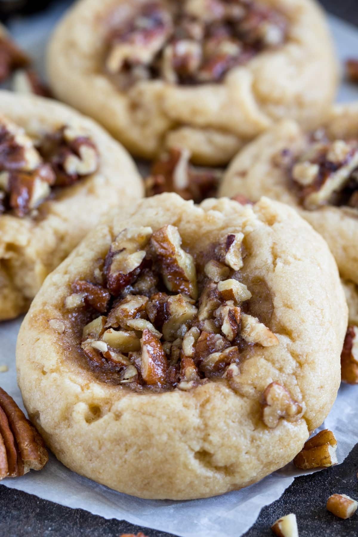 pecan pie cookies close up on parchment.