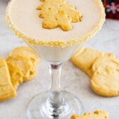 martini in glass with floating shortbread cookie